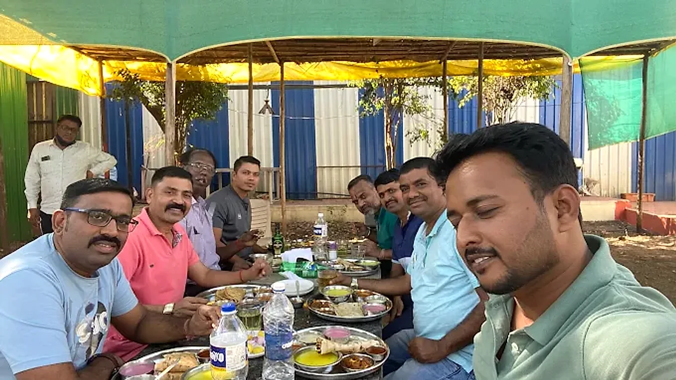 Guests enjoying a meal together at Hotel Atithi